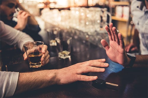 Bar patron being refused service by a bartender because he has had too much to drink