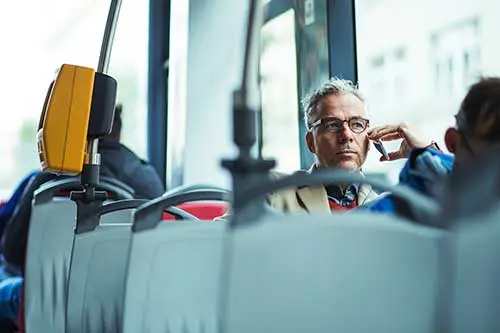 man riding a bus