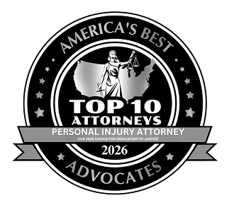 Black and white circular badge featuring Lady Justice over a U.S. map with text “America’s Best – Top 10 Attorneys, Personal Injury Attorney, 2026 – Advocates”