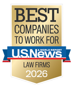 Gold and blue “Best Companies to Work For – U.S. News & World Report Law Firms 2026” award badge on a transparent background